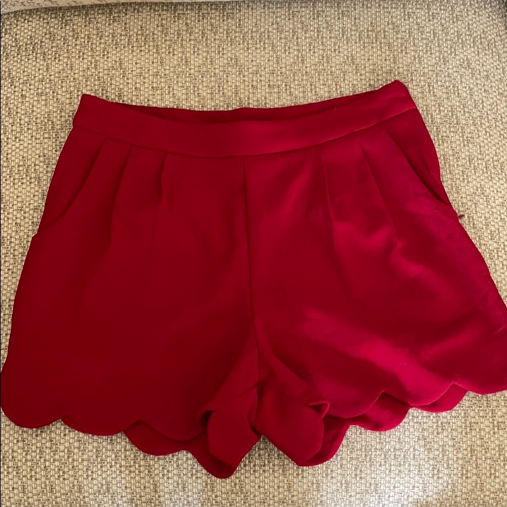Red scalloped shorts with pockets